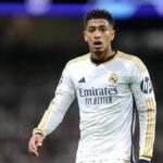 Jude Bellingham of Real Madrid CF reacts during the UEFA Champions League quarter-final first leg match between Real Madrid CF and Manchester City at Estadio Santiago Bernabeu on April 09, 2024 in Madrid, Spain.