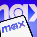 Max streaming service logo on phone with Max logo on a blue background