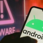 Android logo on phone next to Malware sign