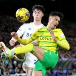 Archie Gray of Leeds United is challenged by Dimitris Giannoulis of Norwich City during the Sky Bet Championship match between Leeds vs Norwich