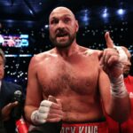 Tyson Fury, wearing red shorts emblazoned with