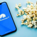 Paramount Plus app on a phone next to popcorn