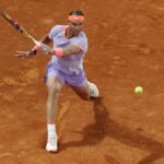 Rafa Nadal plays a shot on clay court