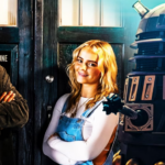 The Fifteenth Doctor (played by Ncuti Gatwa) and his companion Ruby Sunday (Millie Gibson) pose in front of the Tardis as a dalek looms nearby