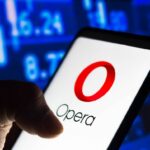 Image of Opera logo on a phone display against a blue background