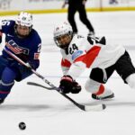 Kendall Coyne Schofield #26 of the United States skates the puck past Noemi Ryhner #24 of Switzerland in the second period during the 2024 IIHF World Championship