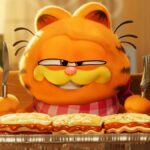 Garfield the cat is about to eat lasagna in The Garfield Movie