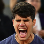 Carlos Alcaraz of Spain celebrates winning match point against Stefanos Tsitsipas of Greece in the Men