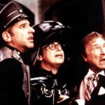 George Wyner (As Colonel Sandurz), Rick Moranis (as Dark Helmet) and Mel Brooks as President Skroob) looking up in fear in Spaceballs