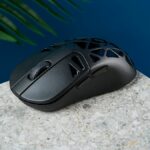 A black Keychron M3 Mini 4K Metal wireless gaming mouse