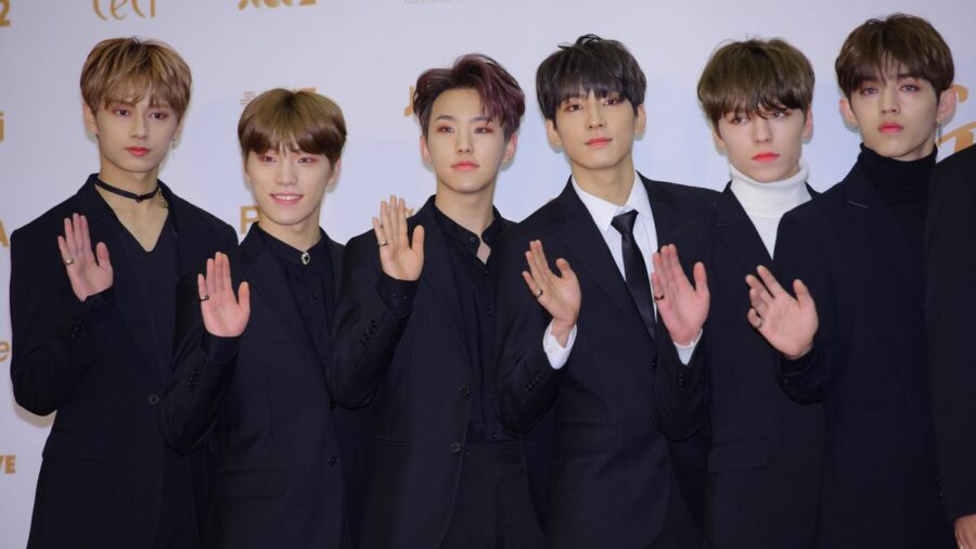 Jun, Dino, Hoshi, Wonwoo, Vernon and S.Coups of SEVENTEEN in black evening suits.