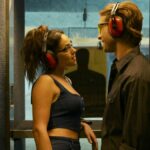 (L-R) Adria Arjona as Madison Masters and Glen Powell as Gary Johnson in