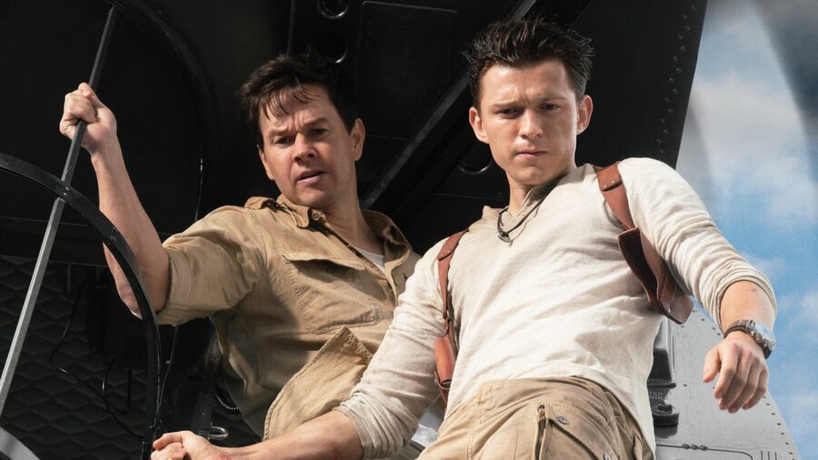 Mark Wahlberg stars as Victor “Sully” Sullivan and Tom Holland is Nathan Drake — both seen staring out of a helicopter —in Columbia Pictures