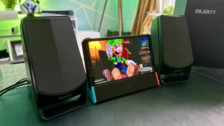 Majority DX30 Bluetooth speakers next to a Nintendo Switch OLED playing Lugi