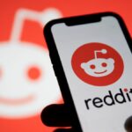 Reddit logo and Reddit logo on phone