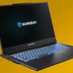 Maingear ML-17 gaming laptop in black against a yellow background.