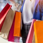 A woman carrying shopping bags in the mall