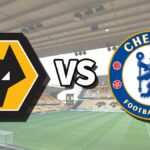 The Wolverhampton Wanderers and Chelsea club badges on top of a photo of Molineux stadium in Wolverhampton, England, the venue for the Wolves vs Chelsea live stream