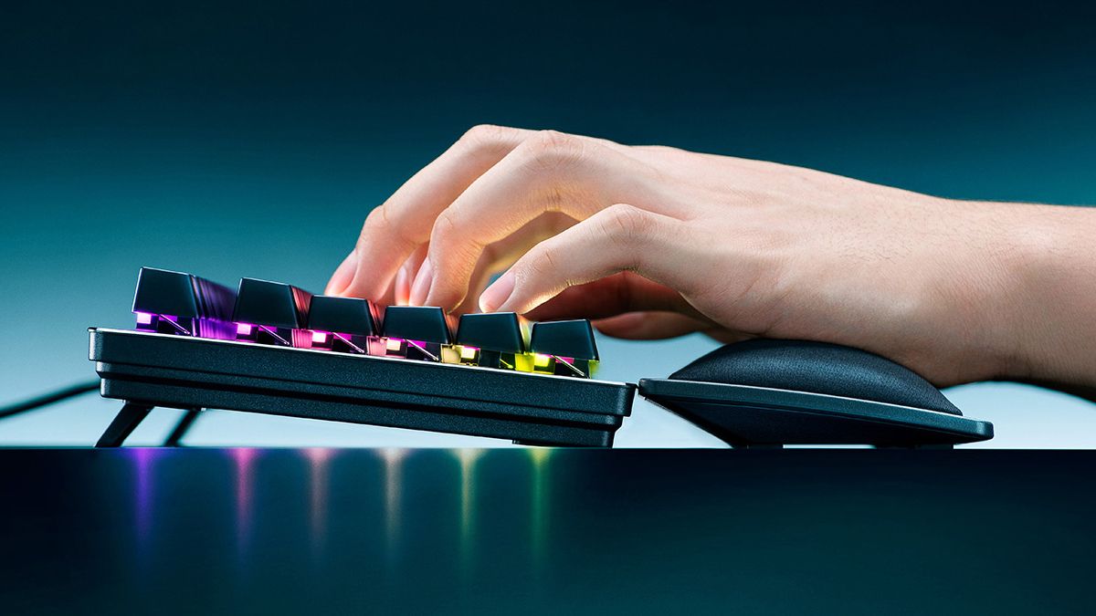 Razer wrist rest paired with a Razer keyboard with a user typing.