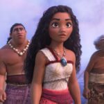 A screenshot from Moana 2, showing Moana (center) flanked by fellow people from Motonui