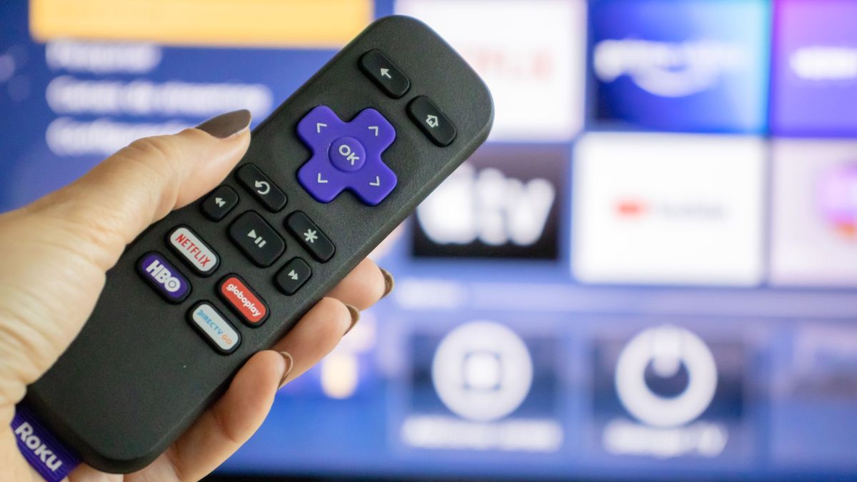 Roku remote in front of TV