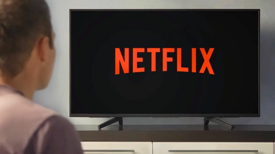 Man watching Netflix on TV