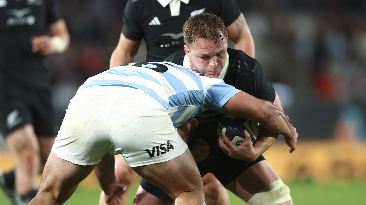 Sam Cane of New Zealand is tackled during The Rugby Championship