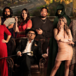 Traitors New Zealand - Some of the season one contestants line-up alongside host Paul Henry (seated)