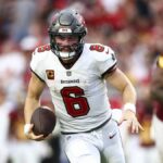 Baker Mayfield #6 of the Tampa Bay Buccaneers carries the ball ahead of the Lions vs Buccaneers live stream