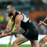 Port Adelaide's Charlie Dixon handballs in a match against Sydney ahead of the AFL preliminary final 2024 live stream.