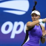 Jessica Pegula hits a forehand at the 2024 U.S. Open tennis, in a purple dress.