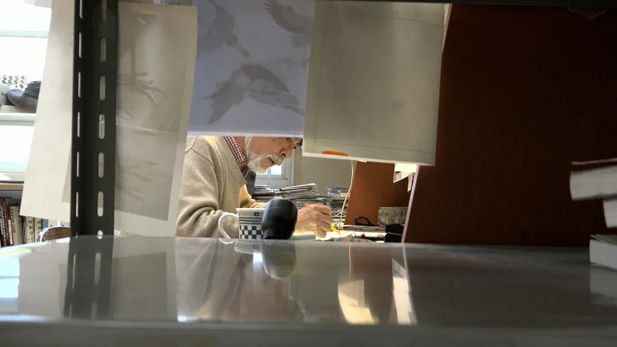 Hayao Miyazaki draws at his desk in 'Hayao Miyazaki and the Heron'