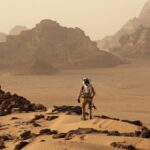 Mark Watney (Matt Damon) walking on the surface of Mars in &quot;The Martian&quot;