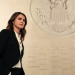 Kate Wyler (Keri Russell) standing in front of a US Crest in Netflix's &quot;The Diplomat&quot; season 1