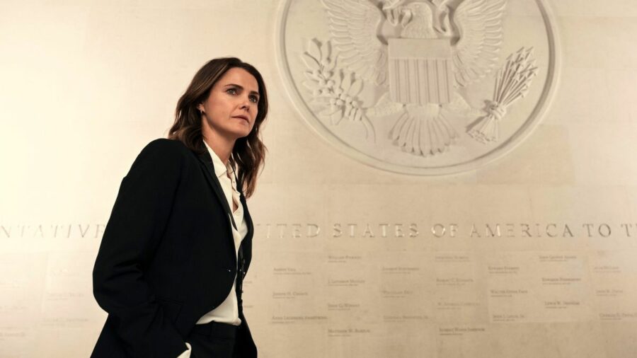 Kate Wyler (Keri Russell) standing in front of a US Crest in Netflix's &quot;The Diplomat&quot; season 1