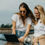 Two women looking at computer screen