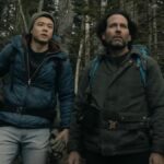 Two hikers stand side by side in From season 3