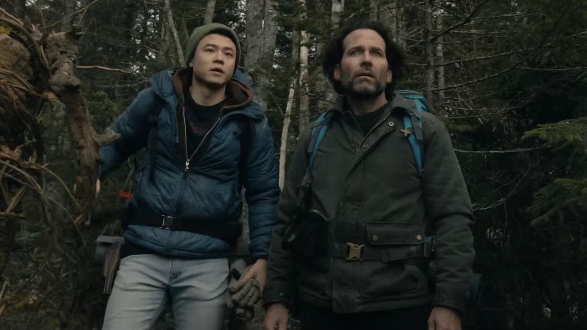 Two hikers stand side by side in From season 3