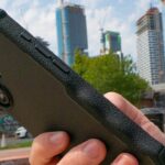 Best iPhone 16 cases smartish Gripzilla held in a hand in front of a cityscape