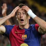 Robert Lewandowski puts his hands on his head ahead of the