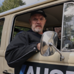 Bearded comedian Greg Davies looks grumpily out of the window of a vintage beige work truck as Paul 'Wicky' Wickstead in season 3 of &quot;The Cleaner&quot;