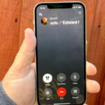 A phone call on an iphone 12, running iOS 18.1, with the call record feature available