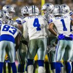 Dallas Cowboys quarterback Dak Prescott (4), huddled with his team, calls a play ahead of the Cowboys vs Lions live stream in NFL Week 6, 2024