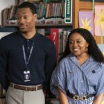 Janine Teagues (Quinta Brunson) and Gregory Eddie (Tyler James Williams) stand in front of rows of bookshelves in Aboott Elementary season 4