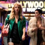 Maxine Minx (Mia Goth) and her friend Tabby Martin (Halsey) walk through a neon-drenched Los Angeles in Ti West horror film &quot;MaXXXine&quot;