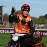 Italian jockey Cristian Demuro riding Favourite Ace Impact celebrates after winning the Qatar Prix de l'Arc de Triomphe horse race at the Paris Longchamp racecourse in Paris ahead of the 2024 L'Acr de Triomphe