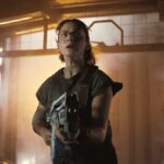 Rain Carradine (Cailee Spaeny) armed with a pulse rifle as seen in &quot;Alien: Romulus&quot;