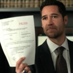 Micky Haller (Manuel Garcia-Rulfo) holding a legal document as seen in &quot;The Lincoln Lawyer&quot; season 3