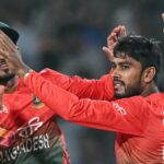 Bangladesh's Mehidy Hasan Miraz celebrates with his captain Najmul Hossain Shanto (L) after taking the wicket of India's Sanju Samson ahead of the India vs Bangladesh 2nd T20 2024 live stream