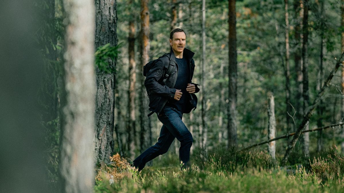 Martian (Michael Fassbender) walking through the woods in Paramount Plus' &quot;The Agency&quot;